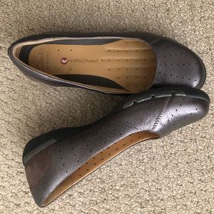 Metallic and mink coloured loafers by Clark’s.